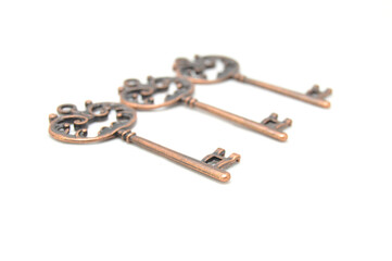 Vintage key on white background close-up. Texture, background, old, macro, wallpaper, metal, brass