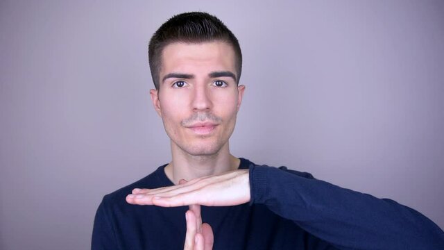 Man shows with his palms the sign of the timeout
