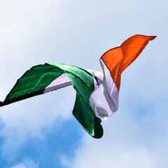 Indian Tricolour National Flag Waving In The Blue Sky.