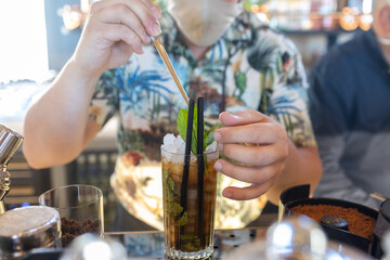 Barman prepares a cocktail mojito, cocktails
