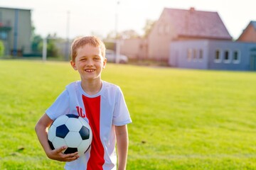 Naklejka premium Young boy in football team. Active lifestyle concept.