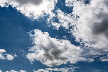 Summer Blue Sky and white cloud white background. Beautiful clear cloudy in sunlight calm season. 