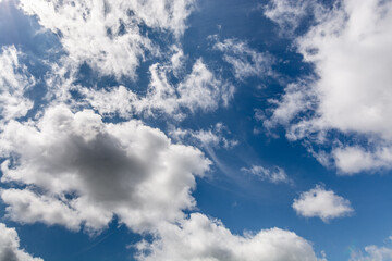 Summer Blue Sky and white cloud white background. Beautiful clear cloudy in sunlight calm season. 