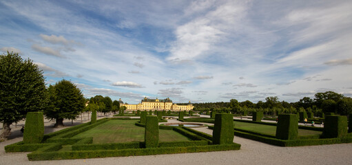 Park and beautiful palace under the blue sky on a summer day