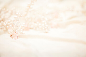 white pearls and pink jewels nestled in white silk - obrazy, fototapety, plakaty