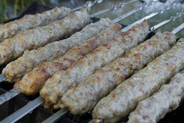 Cooking Of Lula Kebab On The Grill At Picnic