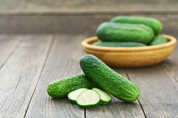 Fresh cucumber on the wooden table with copy space for text.
