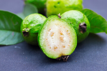 selective focus of fresh and green guavas.