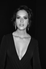 Naklejka premium Editorial black and white photo, sensual woman, face, makeup.black background, professional photo.