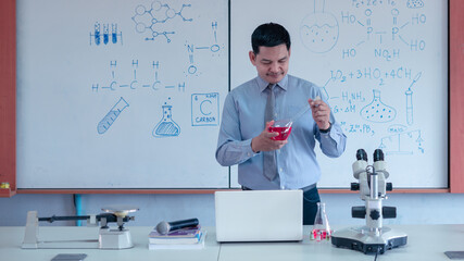 Teacher is teaching science classes online during lockdown due to COVID-19 pandemic