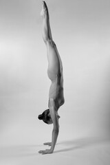 Handstand isolated white background, gymnast in perfect body leotard.