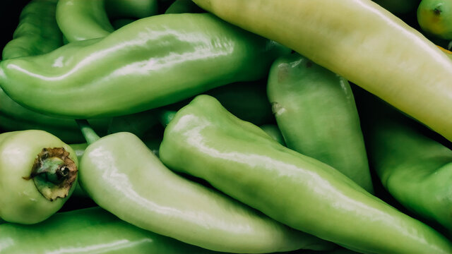 Green chili peppers stacked texture background