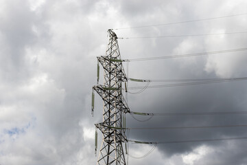 power lines close-up on the background of a black cloud