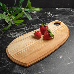 wooden board with strawberry on the table