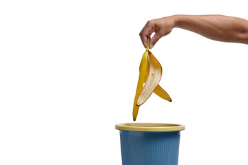 In a man hand, banana peel is thrown into trash.Food waste.
