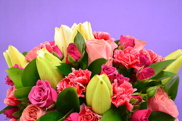 Decoration of flowers with beautiful colors, on purple background.