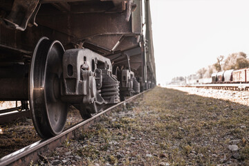 Freight train carriages. Close up of railway wheels. Railway transport system.