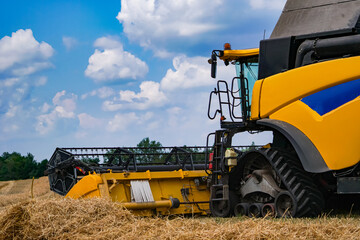 Special machine harvesting crop in fields, Agricultural technic in action. Ripe harvest concept....