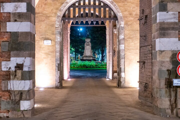 Fototapeta na wymiar Porta San Pietro at night, Lucca - Tuscany.