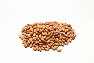 Pile of pinto beans isolated on white background