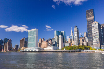 Fototapeta na wymiar A picture of the United Nations building in New York City, USA. In the picture one can see the East River and Manhattan skyline