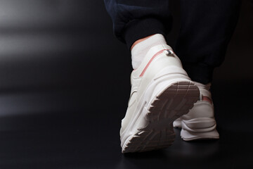 White sneakers for walking. Healthy walk exercises.