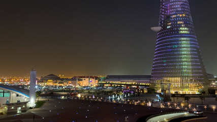 Scenic view of Villagio Mall and Torch Tower in Doha, Qatar, at night.