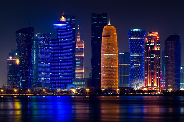 Illuminated skyline of Doha at night, Qatar, Middle East.