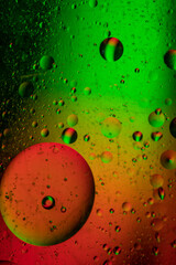 Abstract background similar to drops of water, the result of mixing water and oil. Full color. Abstract colorful circles wallpaper. Macro photograpy.