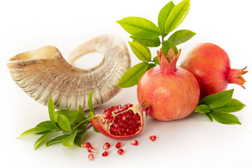 Shofar, pomegranate and pomegranate seeds. Rosh Hashanah (Jewish New Year holiday) concept.