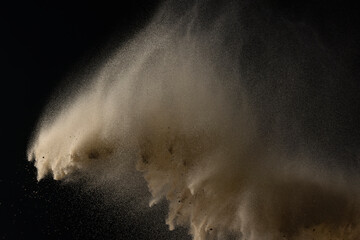 Sand particles and dust flying through air