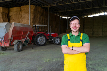 Portrait of Young Farmer Standing on the hayloft
