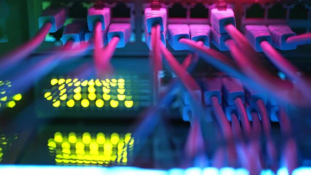 Super computer server racks in datacenter. Concept of big data storage and mining cryptocurrency. Network routers of ISP. Many wires connect to the network interfaces of powerful internet servers