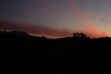 Silhouette land on sunset