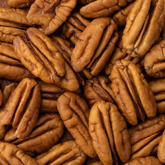Closeup top view of pecan nuts. Food backdrop