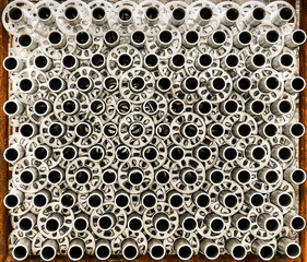 Pile of aluminium pipes.