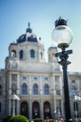 Fototapeta na wymiar Lamp in Vienna with Baroque architecture background 