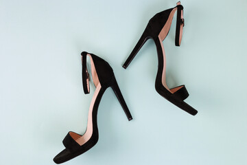Sexy women black sandals with high-heeled stilettos on a tiffany background. Flat lay with copy...