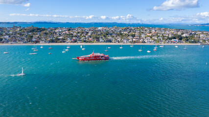 Fototapeta na wymiar Aerial View from the Beach, Boat, City Streets and Waves - Tahuna Torea, Bucklands Beach View in New Zealand - Auckland Area 