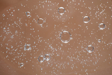 The texture of the foam of a cosmetic product, washing gel or shower gel.