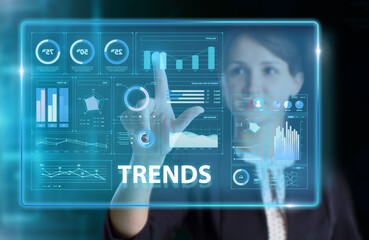 Obraz premium Business, Technology, Internet and network concept. Young businessman working on a virtual screen of the future and sees the inscription: Trends
