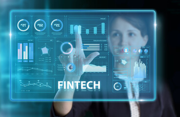 Fototapeta premium Business, Technology, Internet and network concept. Young businessman working on a virtual screen of the future and sees the inscription: Fintech