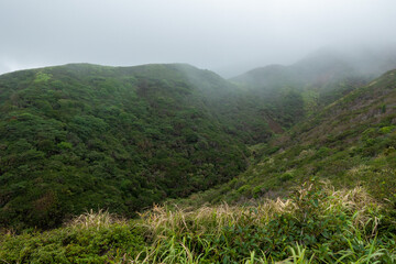 熊本県阿蘇市の烏帽子岳、阿蘇山を登山をしている風景 Scenery of climbing Mount Eboshi-dake and Mount Aso in Aso City, Kumamoto Prefecture. 