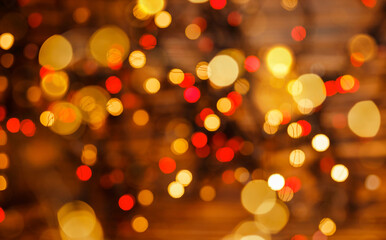 Defocused lights background. Festive mood. Holiday, beautiful shiny Christmas lights, glowing magic bokeh. Abstract gold bokeh light night luxury background. New Year, holiday blurred background.