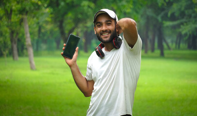 man with mobile phone and headphone happy