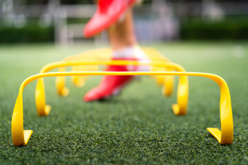 A yellow step-over ladder for speed and leg strength training equipment (Focus), Photo with action...