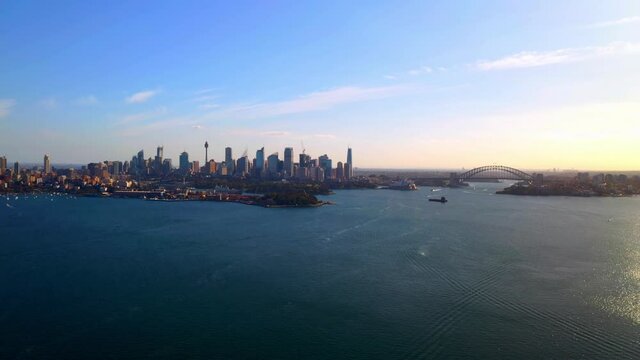 Aerial View of Entire Sydney Harbour in Midday with Highrise Buildings in the Distance.