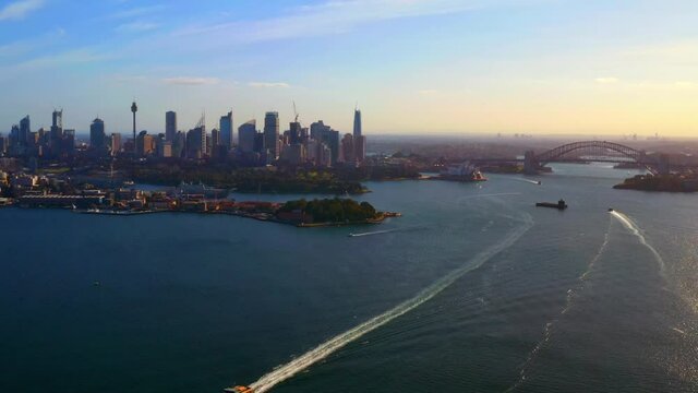 Aerial View of Sydney Harbour Highrise Buildings and Ferry Ship Trails on Water, NSW Australia