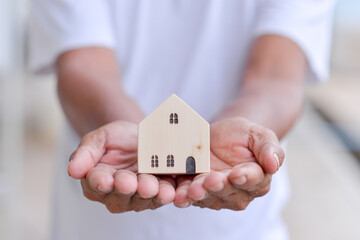 toy house in male hand