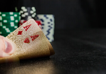 golden poker cards and casino chips